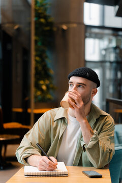 A man works sitting in a cafe