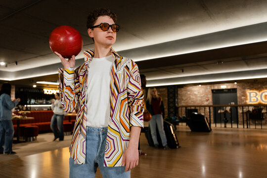 A man is playing bowling