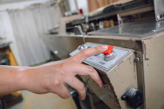 Fototapeta Man operating a textile machine