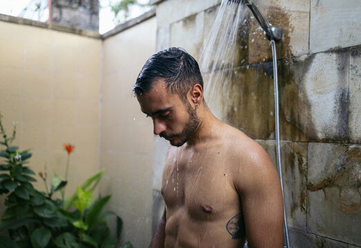 Water Run Down On A Man's Face In Shower