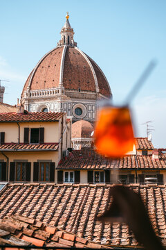 Glass of Aperol Spritz and The Cathedral of Santa Maria del Fiore 