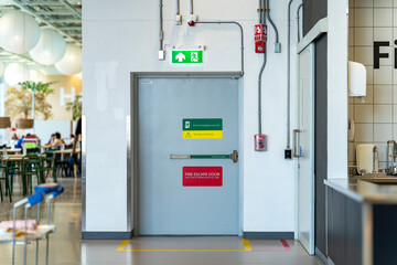 Fire extinguishers and fire escape door within shopping mall