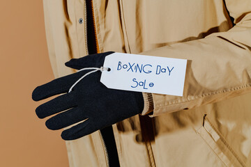 text boxing day sale in a lebel hanging from a glove