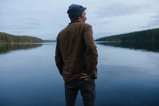 Man at the lake at dusk.
