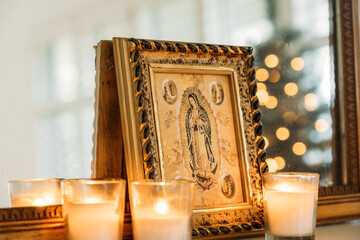Religious Picture and Candles Holiday Decorations on Mantle