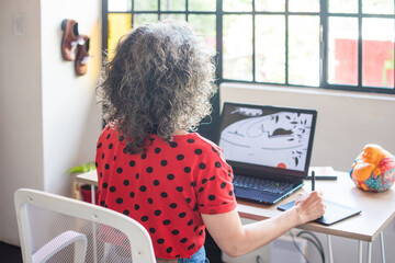 Woman artist working on illustration 