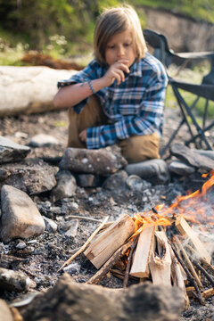 little adventurer at camp fire