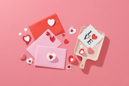 Love letter. white card with red paper envelops
