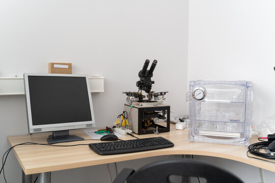 Desk With Computer And Microscope 
