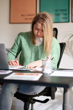 Dedicated Creative student Analyzing Designs