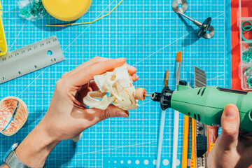 Toy modeler working on miniature