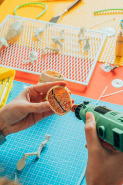 Toy modeler working on miniature