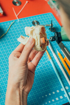 modeler working on miniature.