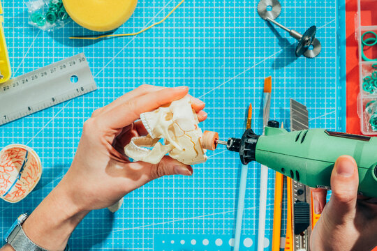 Toy modeler working on miniature