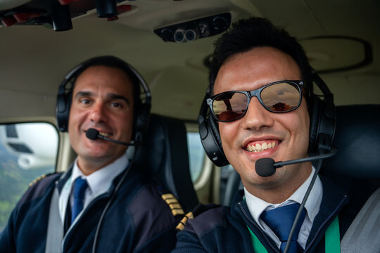 Selfie Portrait Of Pilots Flying An Airplane.