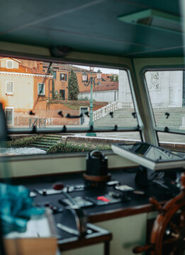Captain's cabin interior with steering wheel and control buttons
