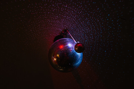 Disco balls reflecting light in a room