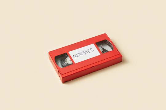 Retro videotape of red color with inscription Memories in studio
