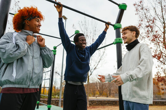 Diverse friends spending time together in park