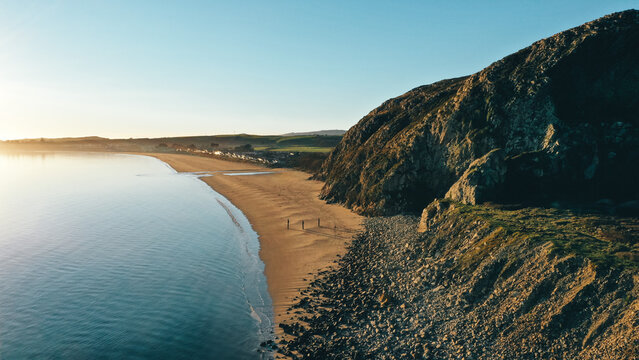 Evening sunlight on the beach and coastal cliffs 