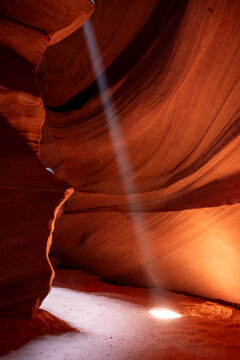 Empty rocky slot canyon with a ray or beam