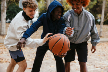 Group Of Friends Having Fun Together At An Outdoor Basketball Court