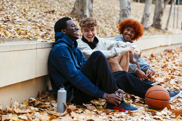 Group Of Friends Having Fun Together At An Outdoor Basketball Court