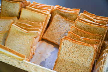 slices of bread in a basket, closeup of photo