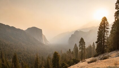 landscape in sequoia national park in sierra nevada mountains on a sunny day smoke from wildfires visible in the background covering the fresno area
