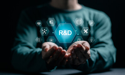 R and D, Research and Development concept. Person holding virtual R and D icons for research and...
