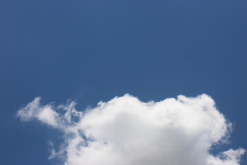 blue sky background with tiny clouds