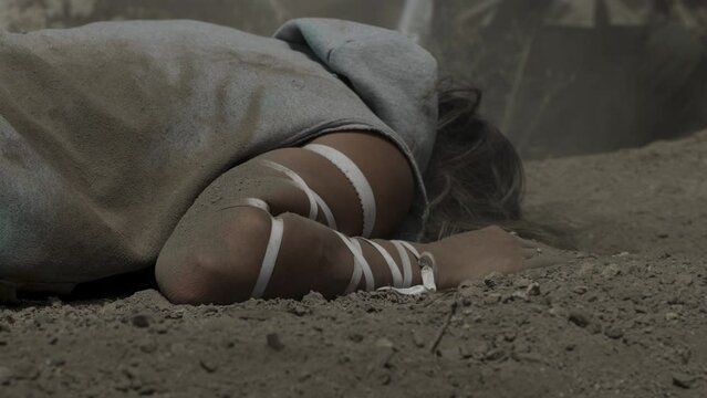 Woman landing in dirt - close up