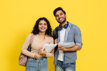 Happy Students Smiling With Notebooks Over Yellow Background, Casual Education Concept, Diverse...