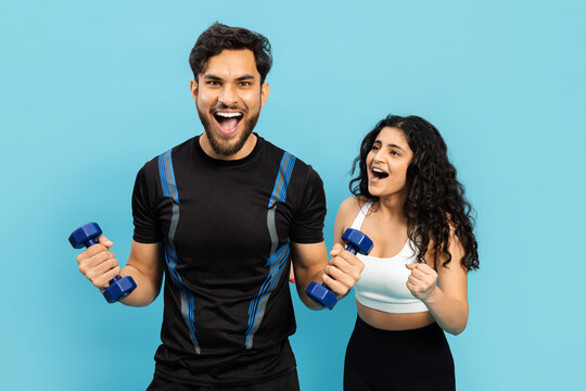 Fitness Couple Working Out Together With Dumbbells On Blue Background, Active Lifestyle, Healthy Living