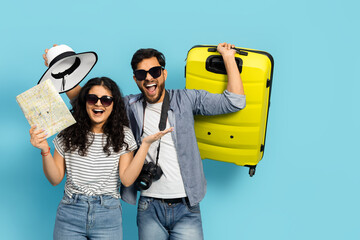 Happy Couple Ready for Vacation with Map and Suitcase on Blue Background, Summer Travel, Holiday...