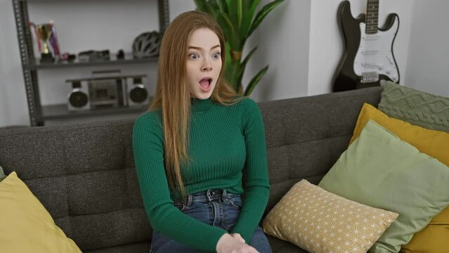 Oops! young beautiful blonde woman wearing sweater at home, hand on head, realizing a foolish mistake. portrait of regretful female with bad memory &ndash; forgot an important thing!