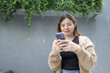 Business asian woman use smartphone internet connection in modern office city building