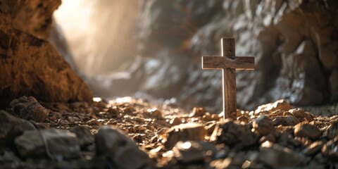 A wooden cross is positioned on top of a rocky hillside, creating a stark and impactful scene