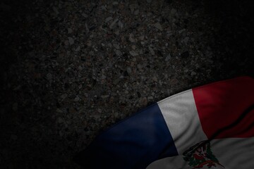 pretty dark image of Dominican Republic flag with large folds on dark asphalt with free place for text - any feast flag 3d illustration..