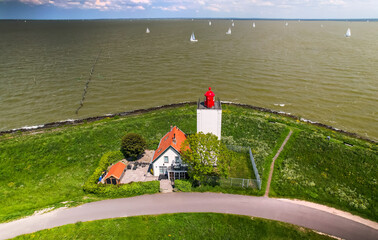 Scenic aerial view of De Ven light house and wildflowers in the Netherlands.