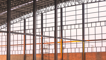 Black metal columns with curve roof beam outline inside of industrial factory building structure in...
