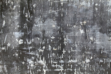 Unclean black wall, texture, background. Dark, unkempt wooden surface with traces of white paint....
