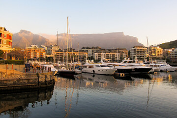 Expensive luxury boats in the marina at the V&A Waterfront, with Table Mountain in the Background,...