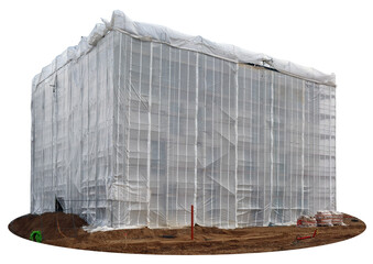 The construction of the house is covered with a huge protective film isolated