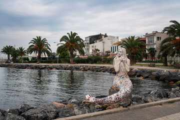 Mosaic sculpture of a mermaid on the promenade along the Marmara Sea on the Buyukada island of the Prince Islands, Istanbul, Turkey - obrazy, fototapety, plakaty