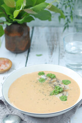 A bowl with mushroom cream soup