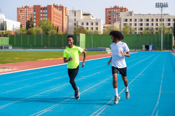 Obraz premium African runners training in an outdoors athletics track