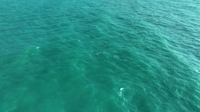 Ocean surface aerial view, sea water texture background by drone. Calm and meditative nature concept. Background of the water surface. 4k.