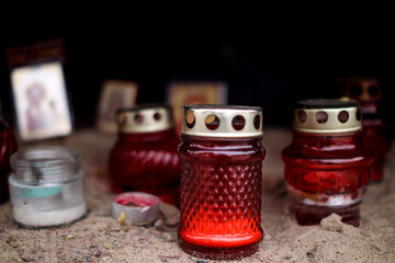 Funeral ritual candles on the sand