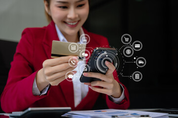 Businesswoman use computers and smartphone to pay through credit card payment channels. Online shopping Sit at the desk.